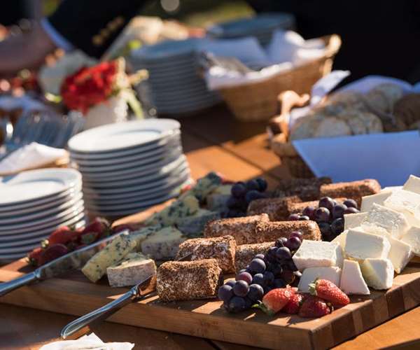 Appetizer table at an event with a Vermont cheese platter
