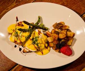 Eggs Benedict made from scratch with roasted asparagus