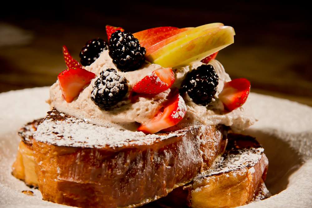 Challah French toast with fresh fruit and cinnamon whipped cream 