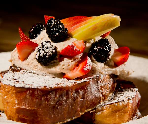 Challah French toast with fresh fruit and cinnamon whipped cream 