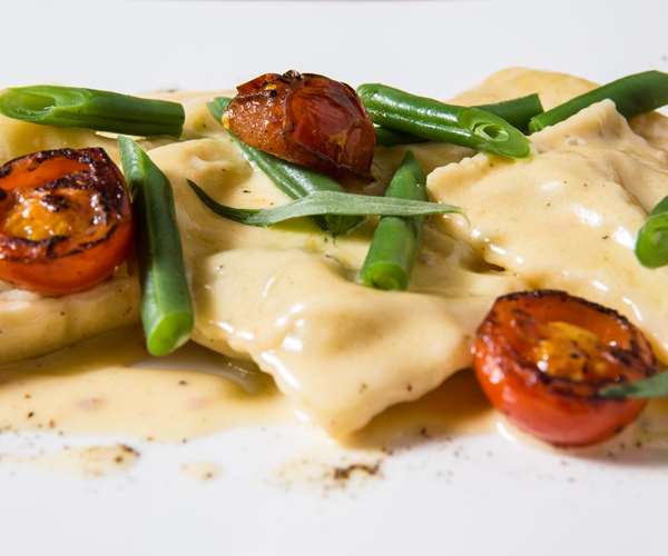 Vermont Fresh Pasta goat cheese ravioli with roasted cherry tomatoes and green beans