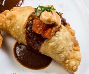 Empanada with mole and chipotle aioli